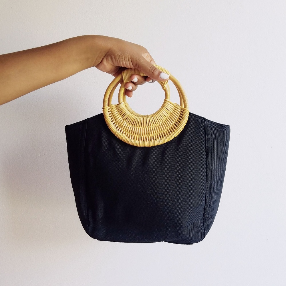Navy blue purse with rattan handle